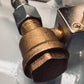 Check multiple de bronce 3/8 X 3/8 X 1/4